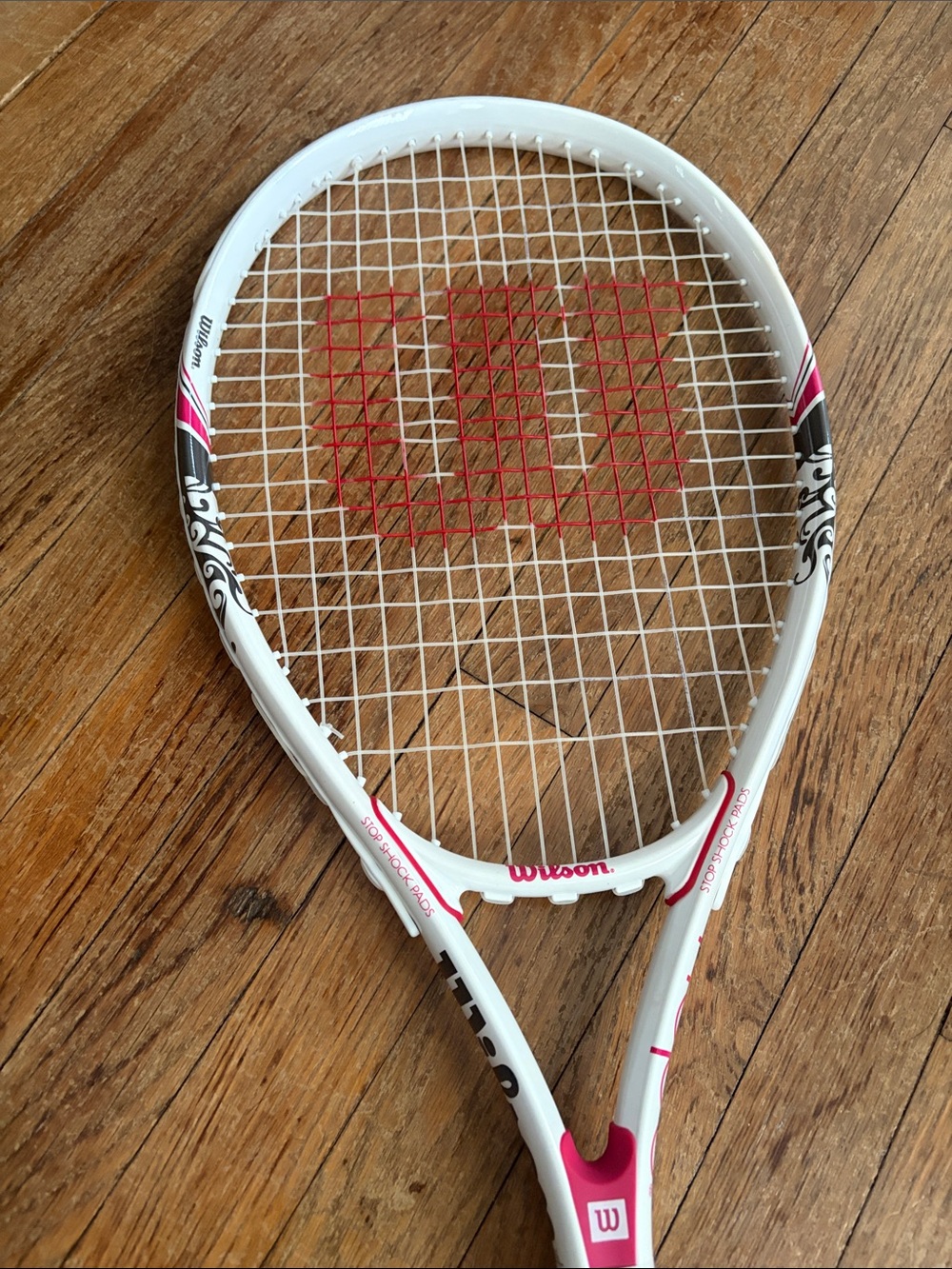 Wilson White and Pink Tennis Racket with Red String Logo